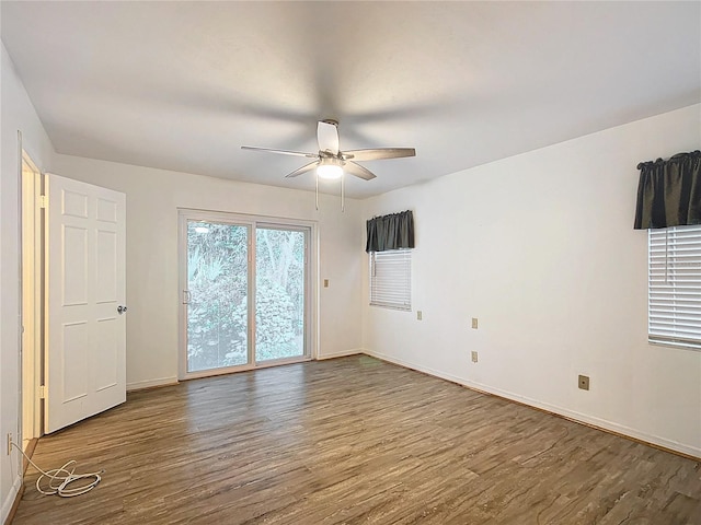 unfurnished room with wood-type flooring and ceiling fan