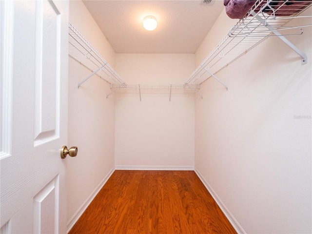 walk in closet featuring hardwood / wood-style floors