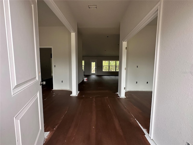 corridor featuring dark wood-type flooring