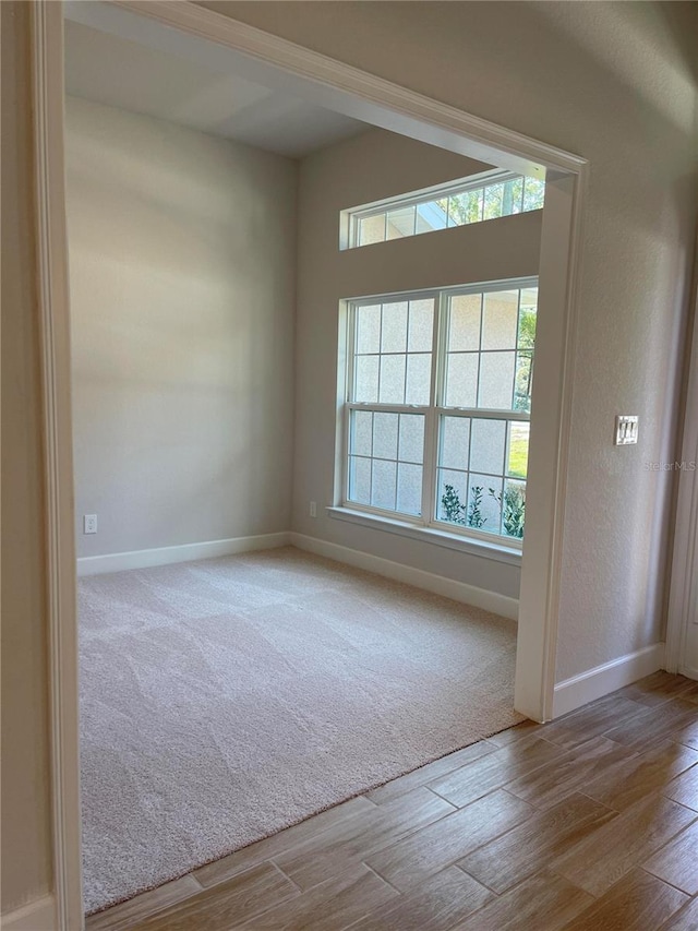 spare room with light hardwood / wood-style floors