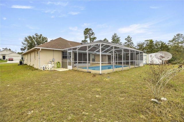 view of swimming pool with a yard and cooling unit