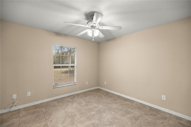 spare room featuring ceiling fan