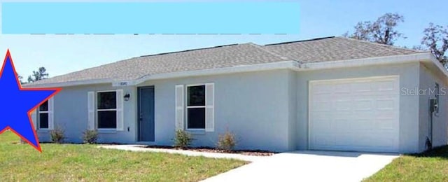 single story home featuring a garage and a front yard