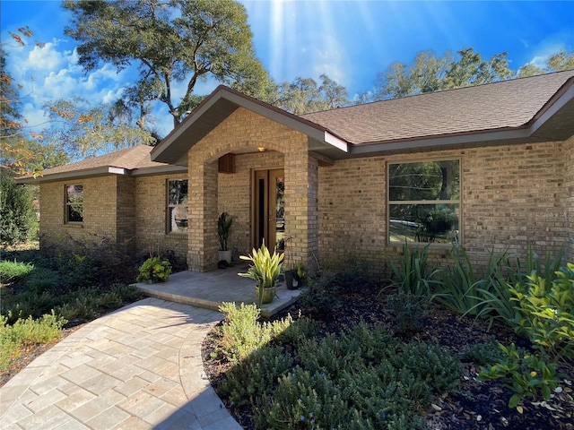 ranch-style home with a patio area