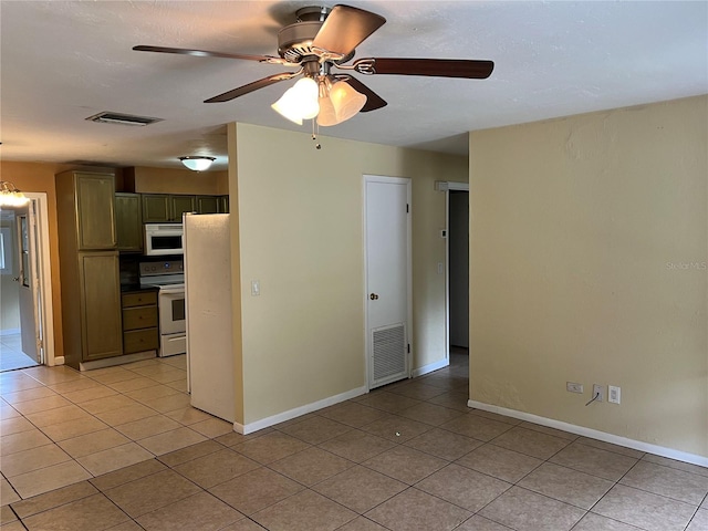 interior space with ceiling fan