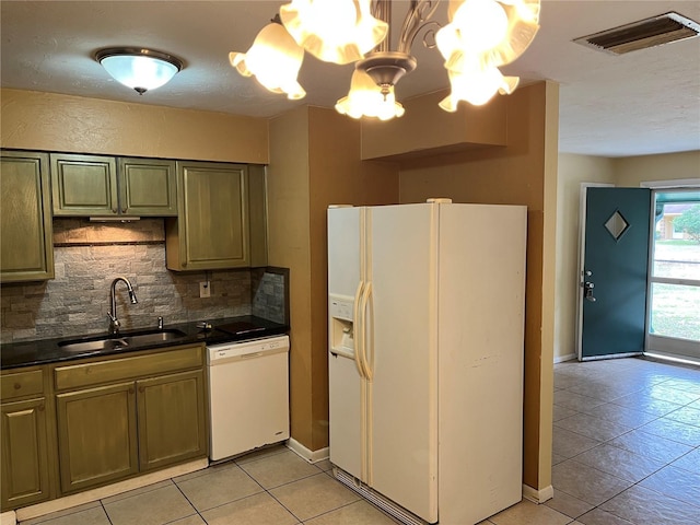 kitchen with sink, backsplash, a chandelier, light tile patterned floors, and white appliances