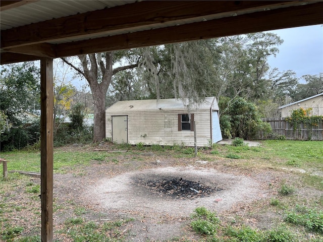 view of yard with a garage and a shed