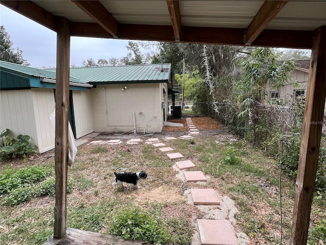 view of yard featuring central air condition unit