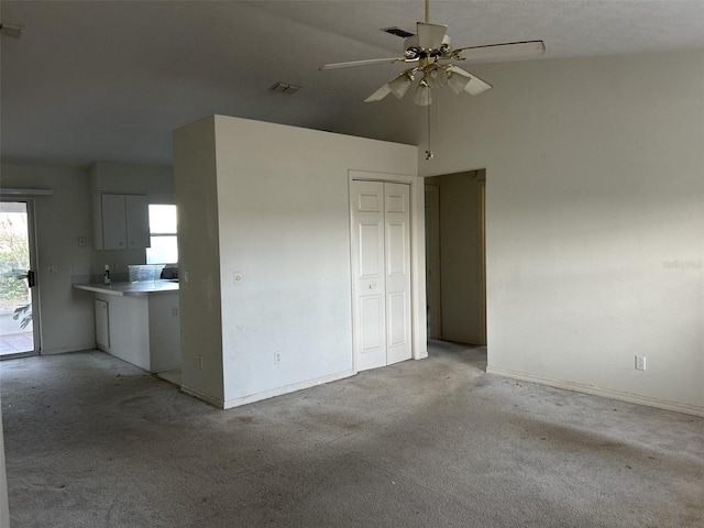 interior space with ceiling fan and high vaulted ceiling