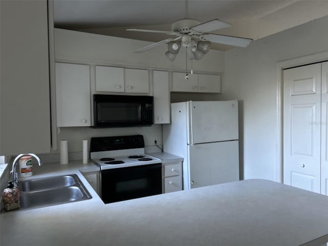 kitchen with electric range oven, white refrigerator, sink, white cabinetry, and ceiling fan