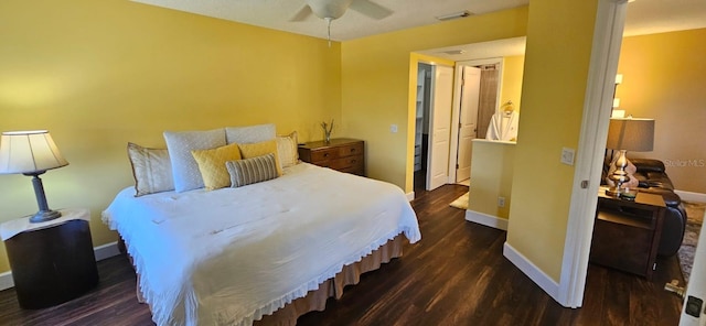 bedroom with dark wood-type flooring and ceiling fan