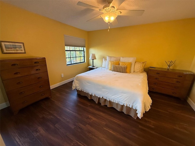 bedroom featuring dark wood-type flooring and ceiling fan