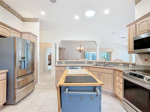 kitchen with sink, light brown cabinets, appliances with stainless steel finishes, and wood counters