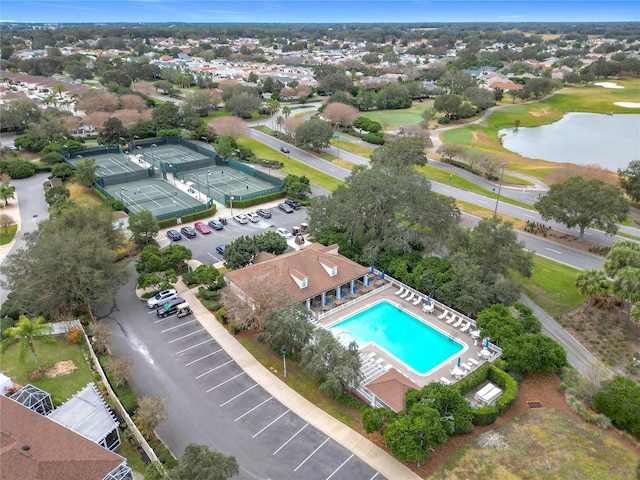 birds eye view of property with a water view