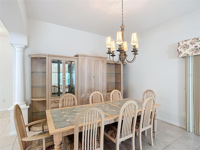 tiled dining area with a notable chandelier and decorative columns