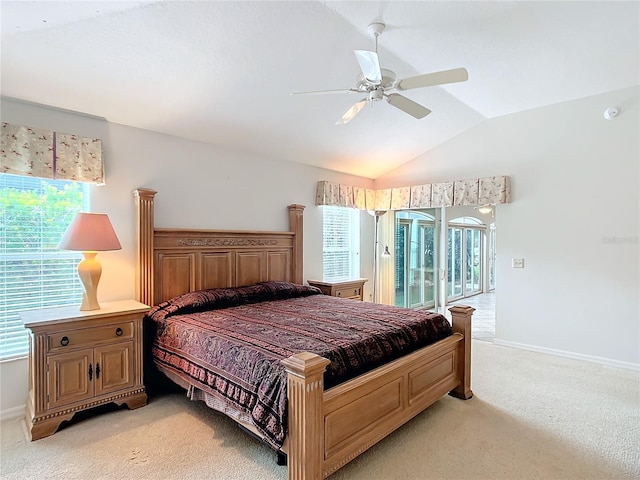 carpeted bedroom with ceiling fan, lofted ceiling, access to outside, and multiple windows