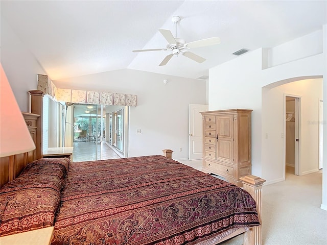 carpeted bedroom with ceiling fan, access to outside, and vaulted ceiling