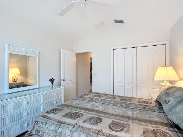 bedroom featuring ceiling fan, a closet, and vaulted ceiling