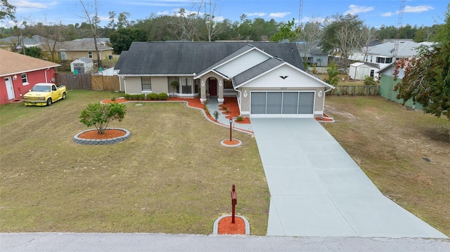 ranch-style home featuring a front yard and a garage