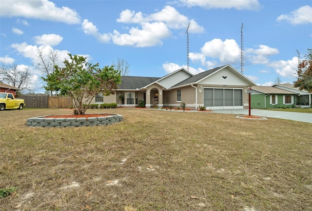 ranch-style house with a garage and a front lawn