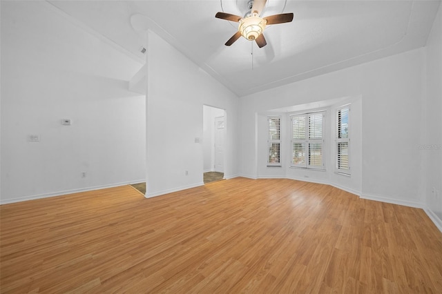 unfurnished living room featuring ceiling fan, light hardwood / wood-style floors, and lofted ceiling