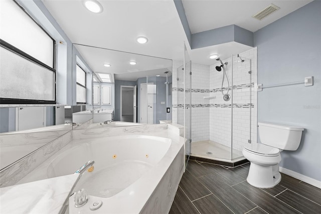 bathroom with separate shower and tub and toilet