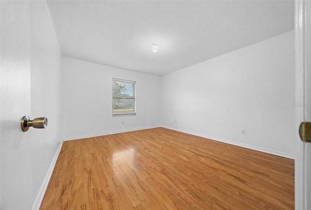 empty room with light hardwood / wood-style floors