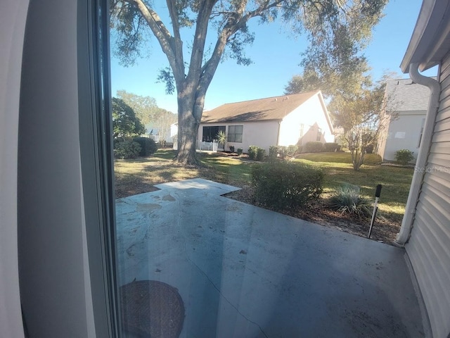 exterior space featuring a patio area and a yard