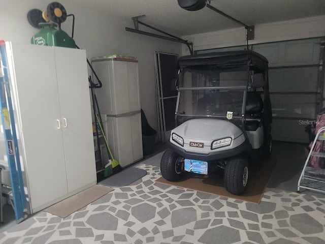 garage featuring a garage door opener