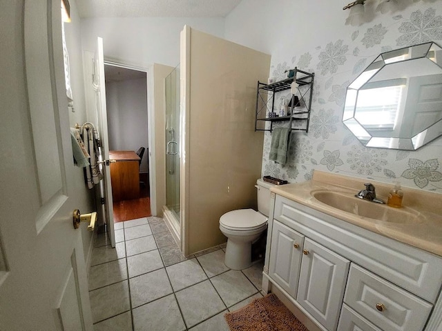 bathroom with toilet, an enclosed shower, vanity, and tile patterned flooring