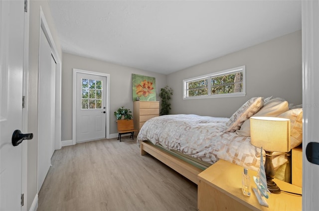 bedroom with a closet and light wood-type flooring