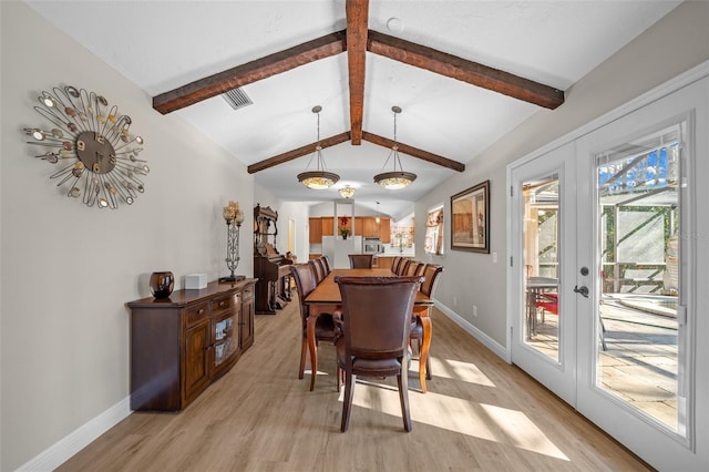 dining room with light hardwood / wood-style floors, french doors, and vaulted ceiling with beams