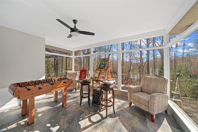 sunroom / solarium with ceiling fan