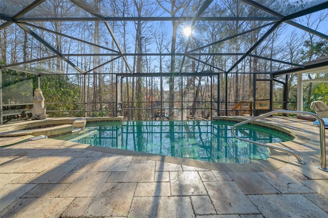 view of pool featuring a lanai, a fireplace, and a patio