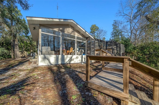 exterior space with a lanai and a sunroom