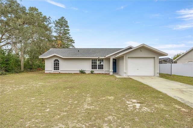 ranch-style house featuring a front yard and a garage