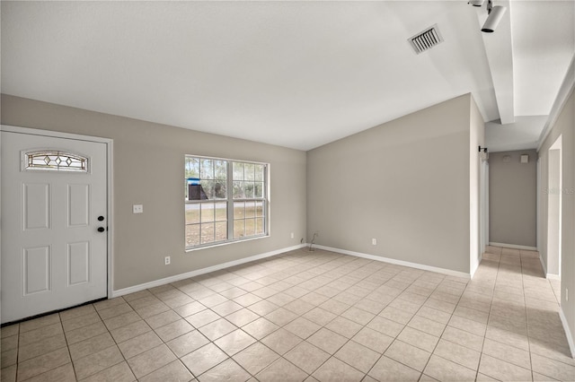 entryway with light tile patterned floors