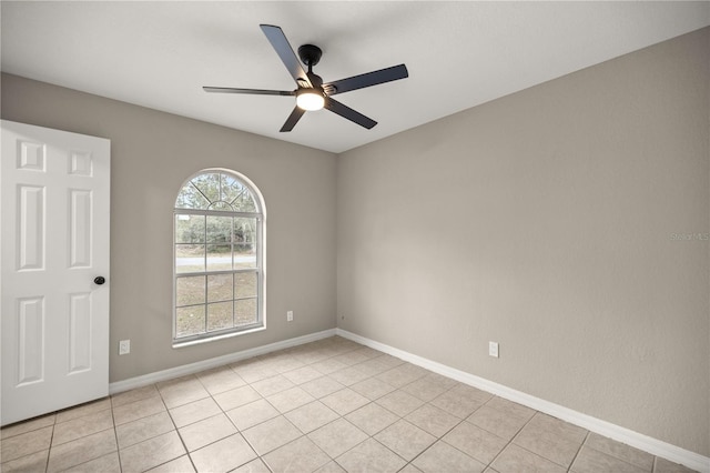 unfurnished room featuring ceiling fan and light tile patterned flooring