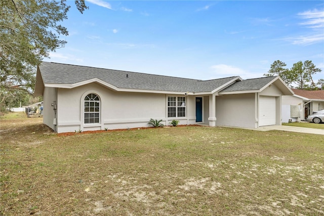 ranch-style home featuring a front yard and a garage