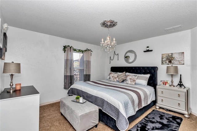 carpeted bedroom with a textured ceiling and a chandelier