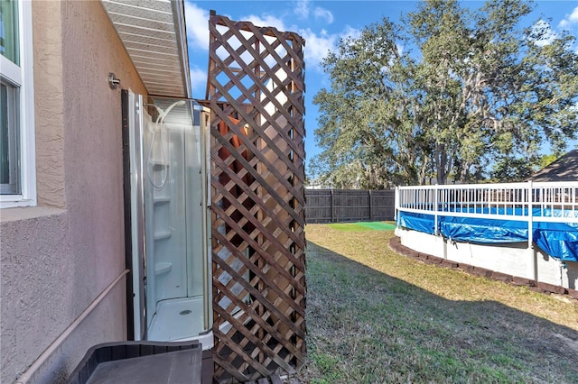 view of yard featuring a covered pool