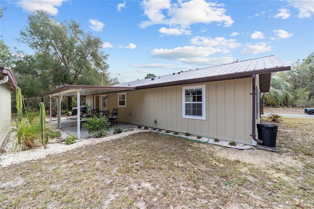 rear view of property with a patio area