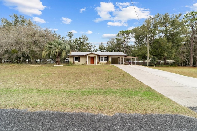 ranch-style house featuring a front yard and a carport