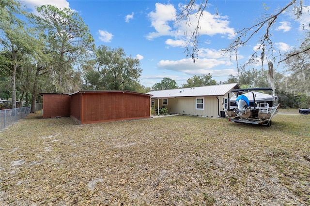 back of house featuring a yard