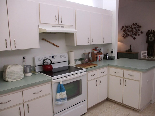 kitchen featuring white cabinetry, light tile patterned floors, and white electric stove