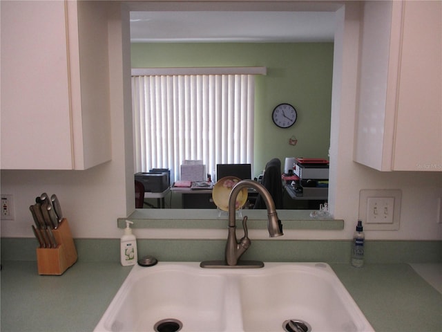 details with sink and white cabinetry