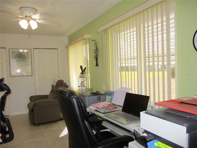 office with ceiling fan and light tile patterned floors