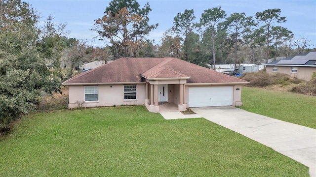 ranch-style home with a front yard and a garage