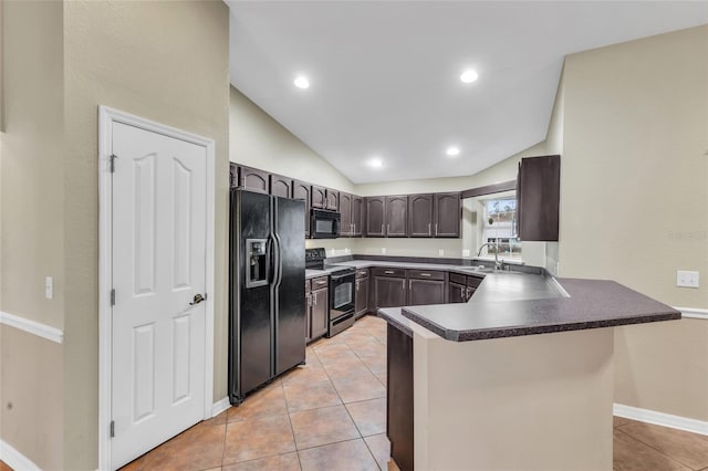 kitchen with black appliances, kitchen peninsula, light tile patterned floors, sink, and lofted ceiling