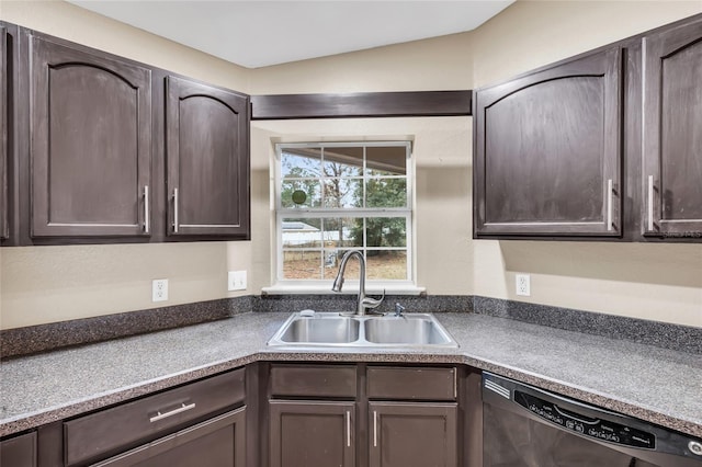 kitchen featuring lofted ceiling, dark brown cabinets, black dishwasher, and sink